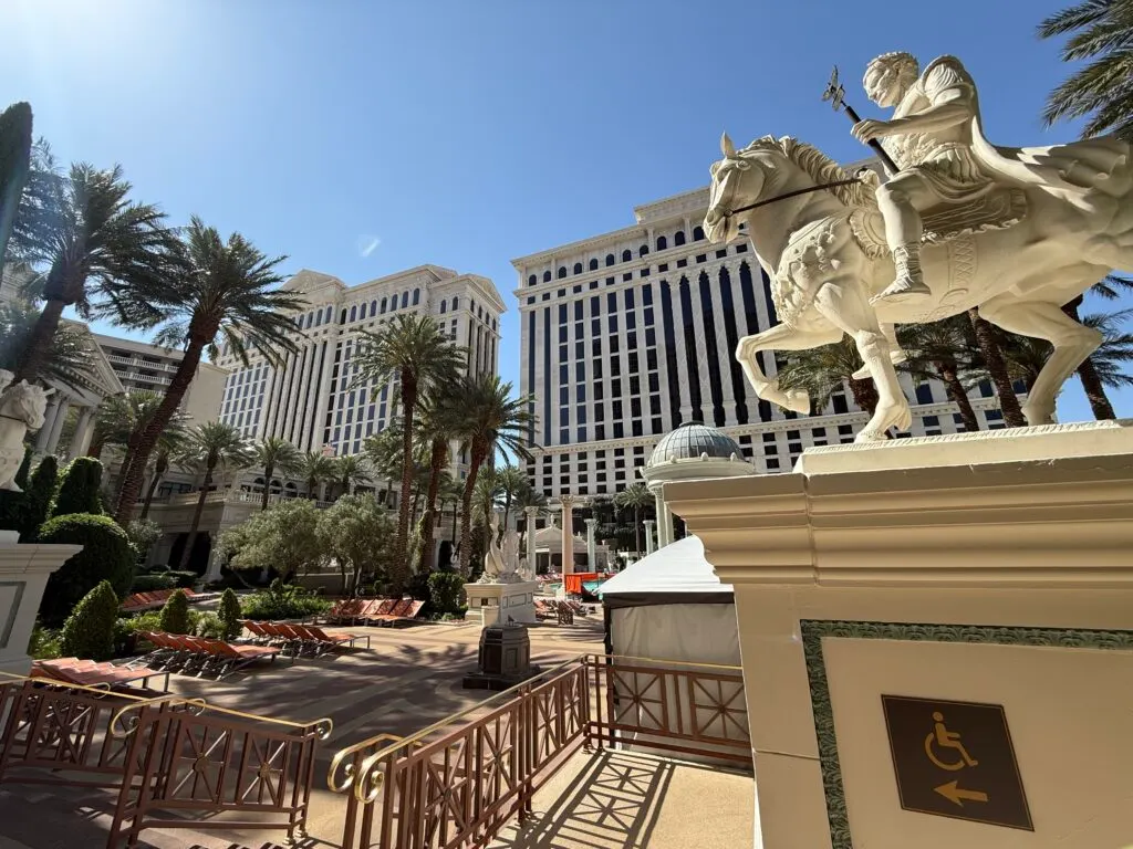 A statue on a horse at the entrance of the pool.