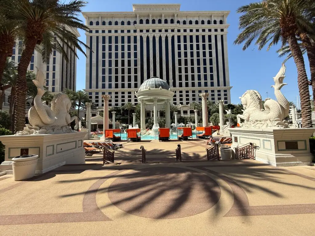 The pool from afar, with a hotel tower behind it.