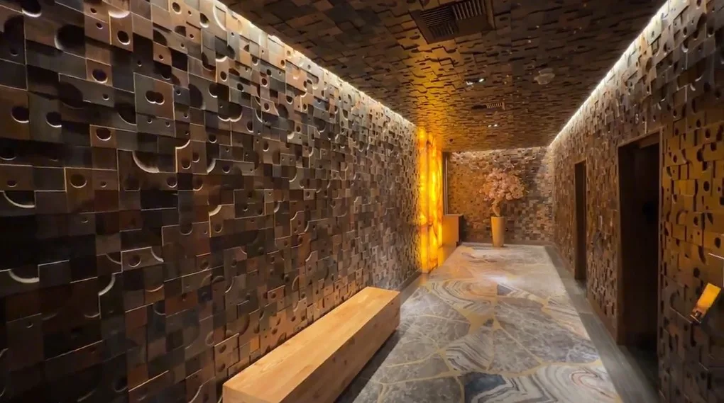 Nobu's elevator lobby, which has decorative wooden blocks on the wall.
