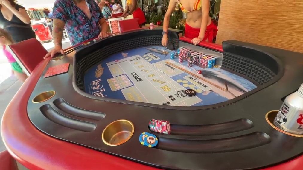 A poolside tub craps game.