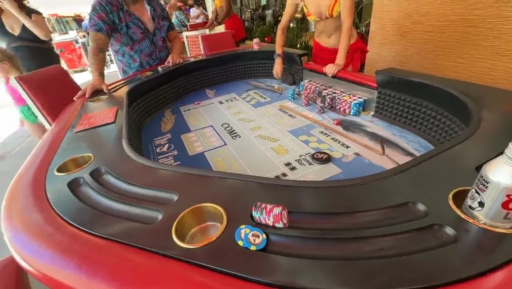 A poolside tub craps game. 