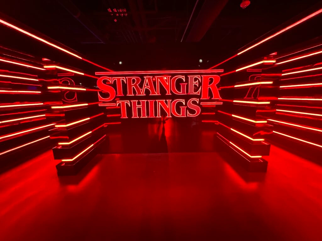An illuminated Stranger Things logo.