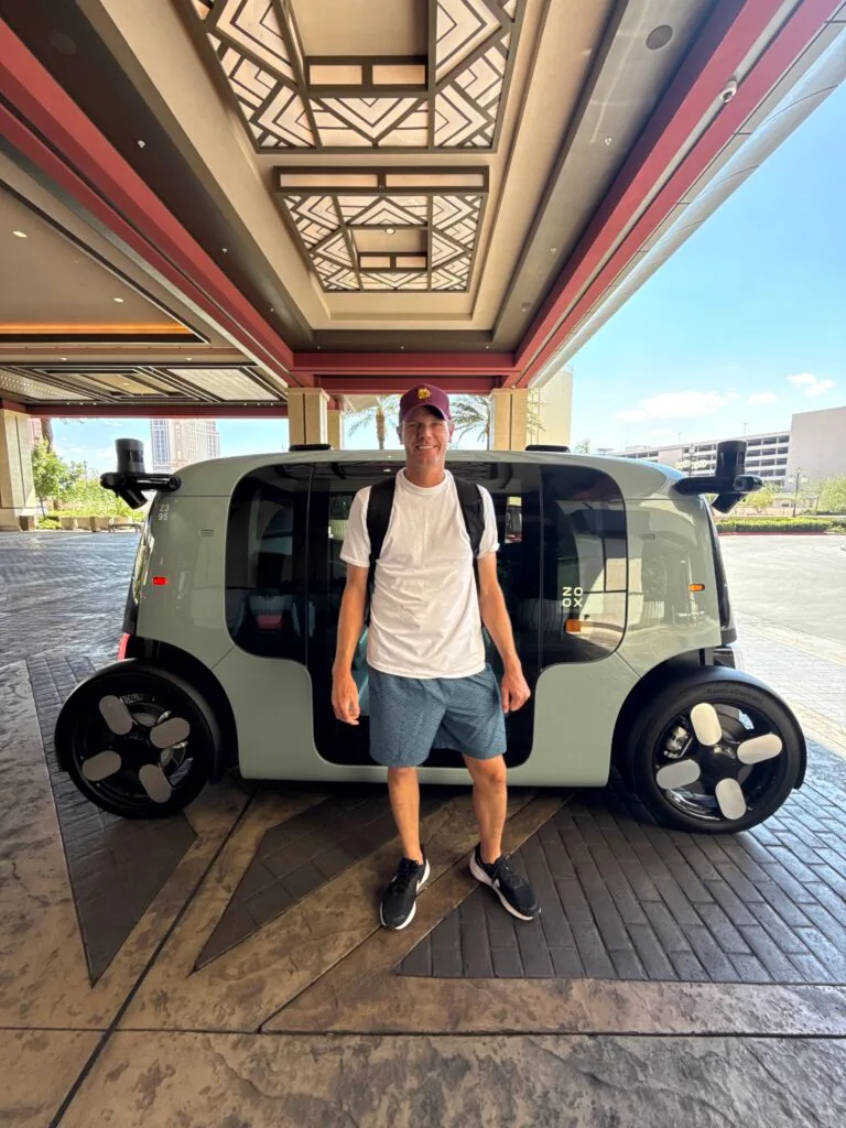 Me, standing in front of my Zoox robotaxi. 