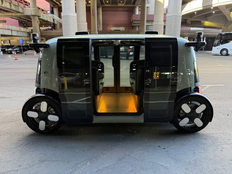 Side profile of my Zoox, with the doors open and ready for me to enter.