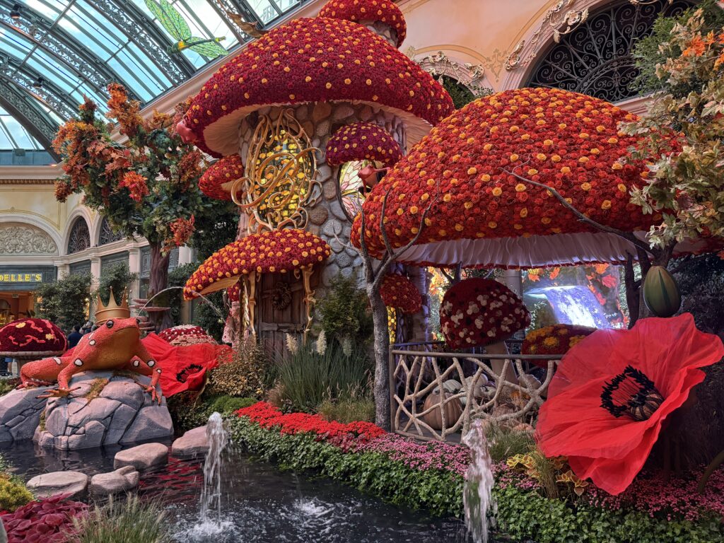 Mushroom style homes with roofs made of red flowers.