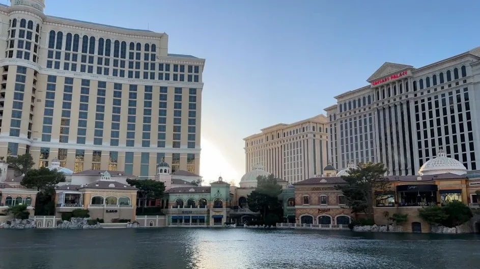 A row of restaurants, viewed from across the mock lake. 