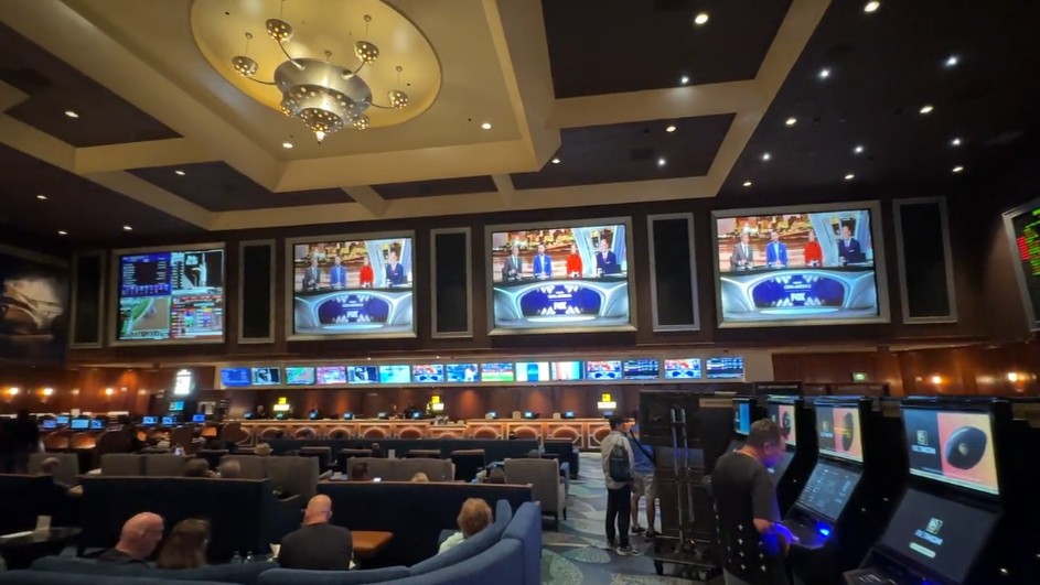 4 massive screens with chairs pointed at them in the book.