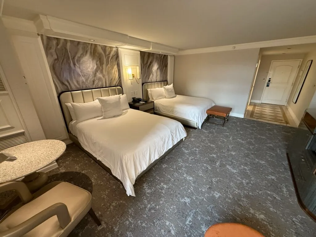 Another angle of the beds that shows the hallway into the room in the background. 