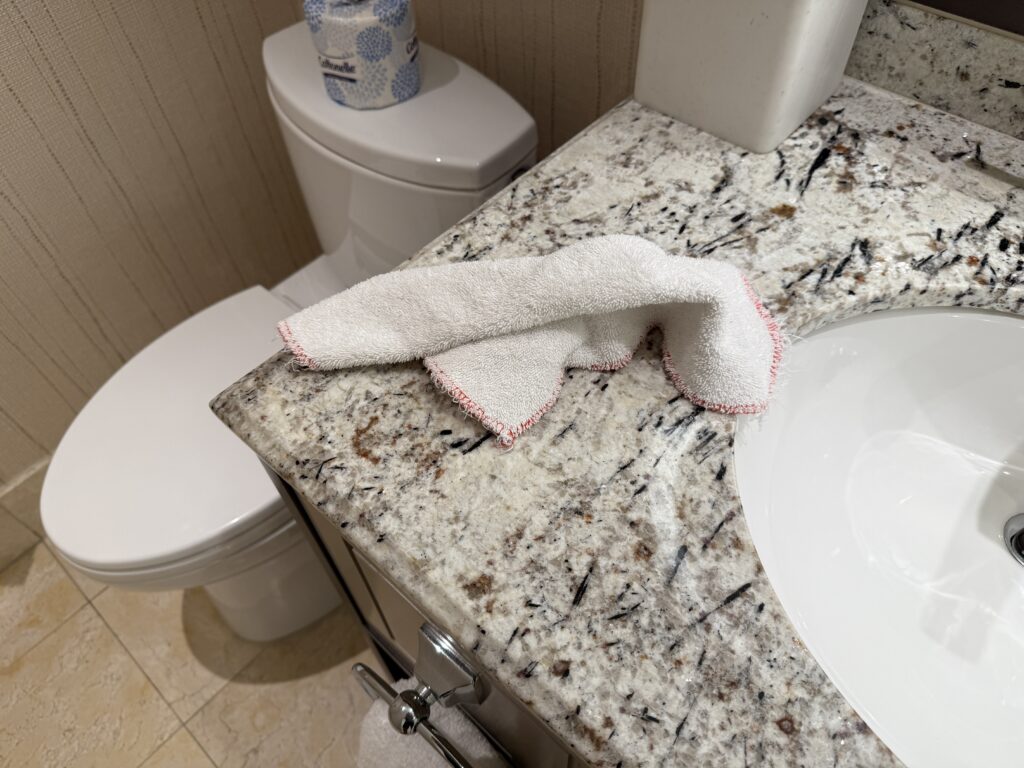 A housekeeping rag, wadded up and left on the countertop.