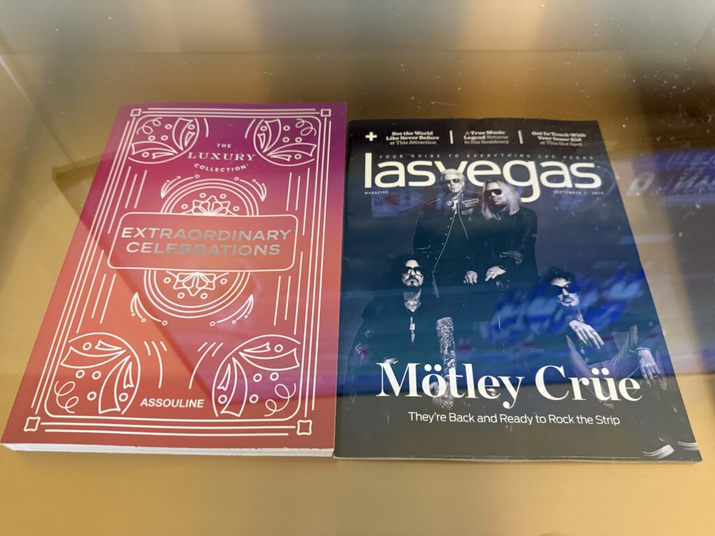2 magazines on a shelf.