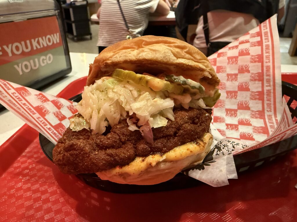 A chicken sandwich, made with a fat breast, cole slaw, and a bun that can barely contain it all.