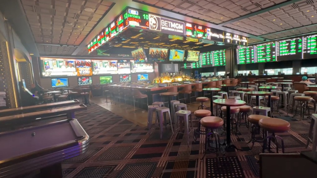 Cosmopolitan's sportsbook, with an island bar.