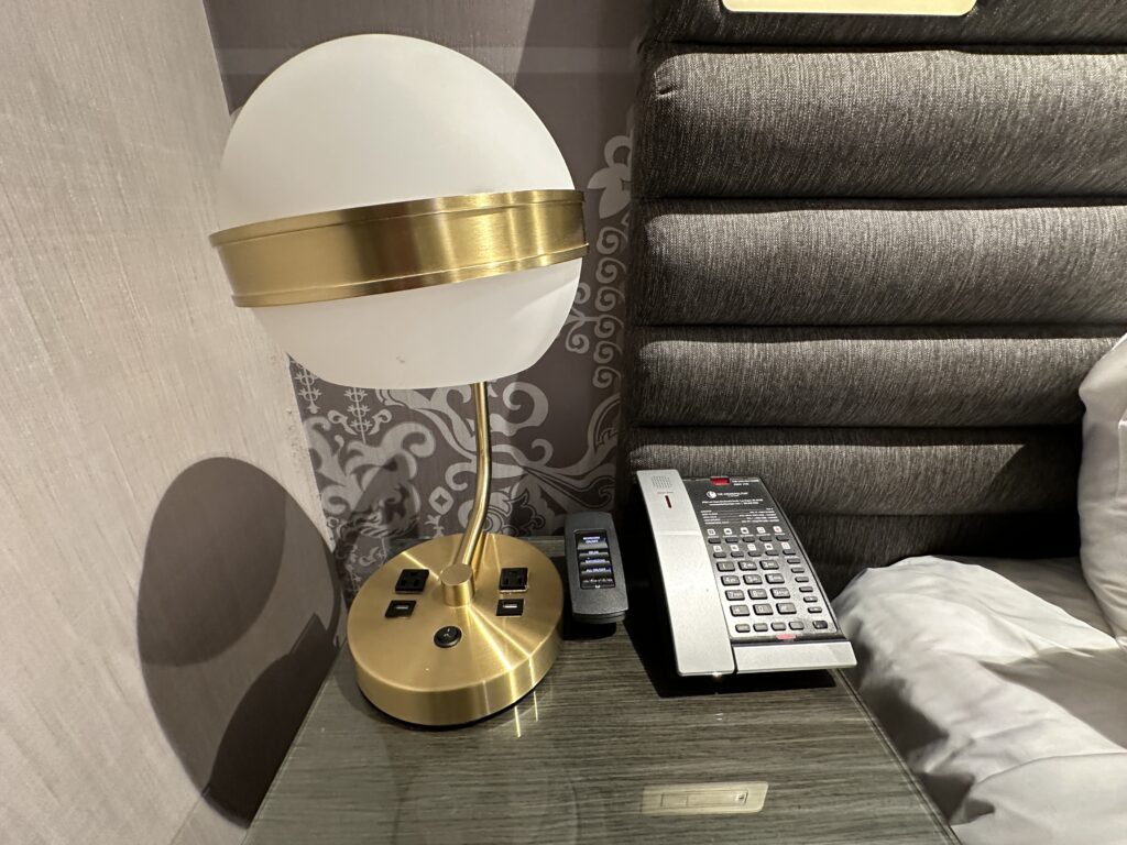 Bedside charging options, embedded in the base of a lamp.