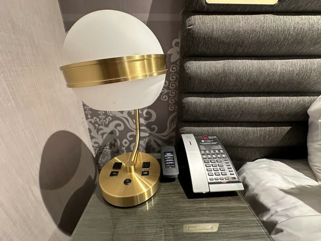 Bedside charging options, embedded in the base of a lamp. 