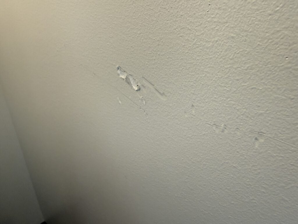 A chunk missing from a wall.