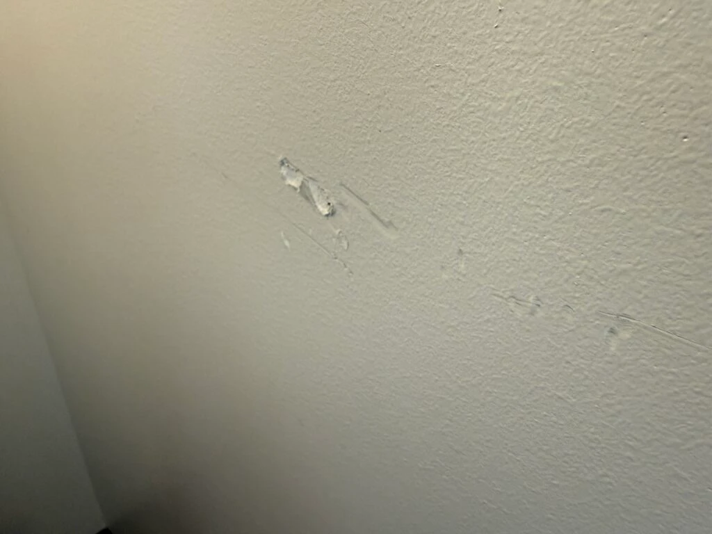 A chunk missing from a wall. 