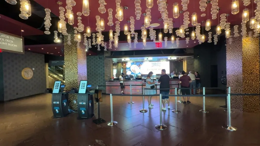 Downtown Grand's hotel lobby, with decortative lighting hanging overhead. 