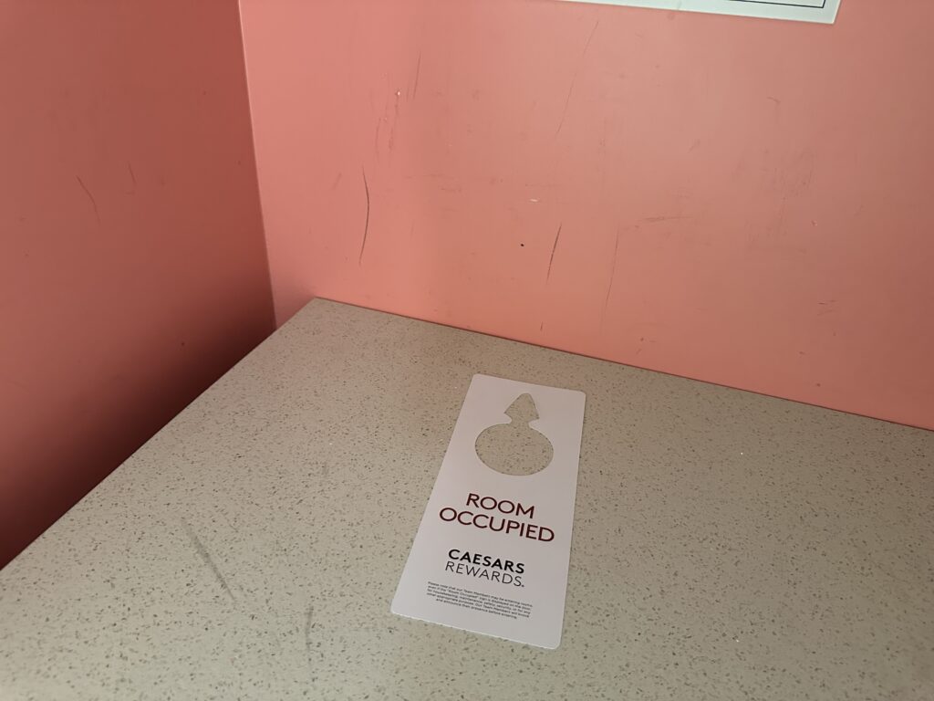 scuffed pink wall in the closet.
