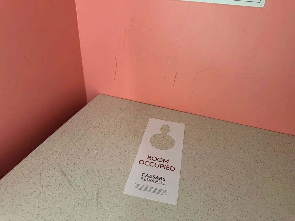 scuffed pink wall in the closet. 