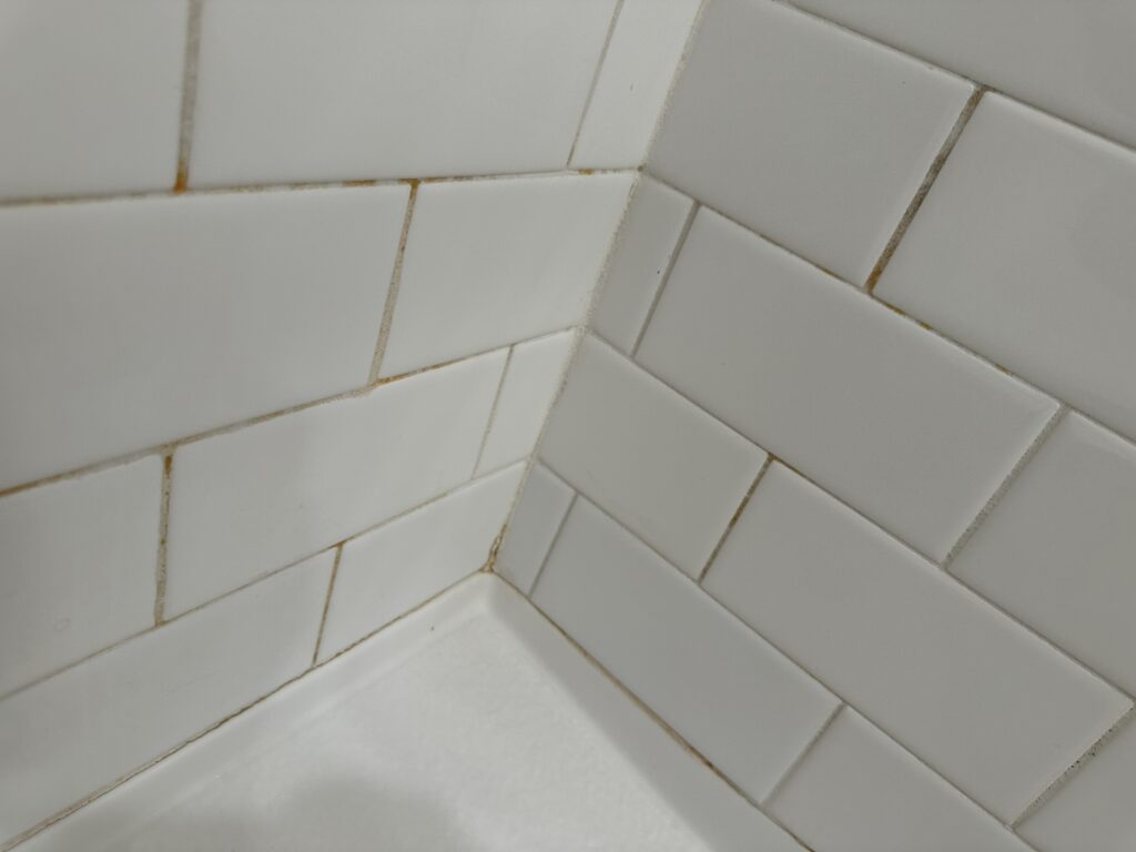 Grout lines that have yellowed.