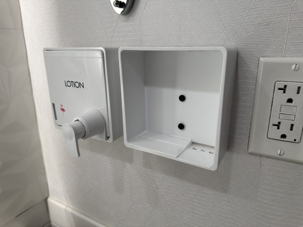 A hand soap dispenser shell, that sits empty.