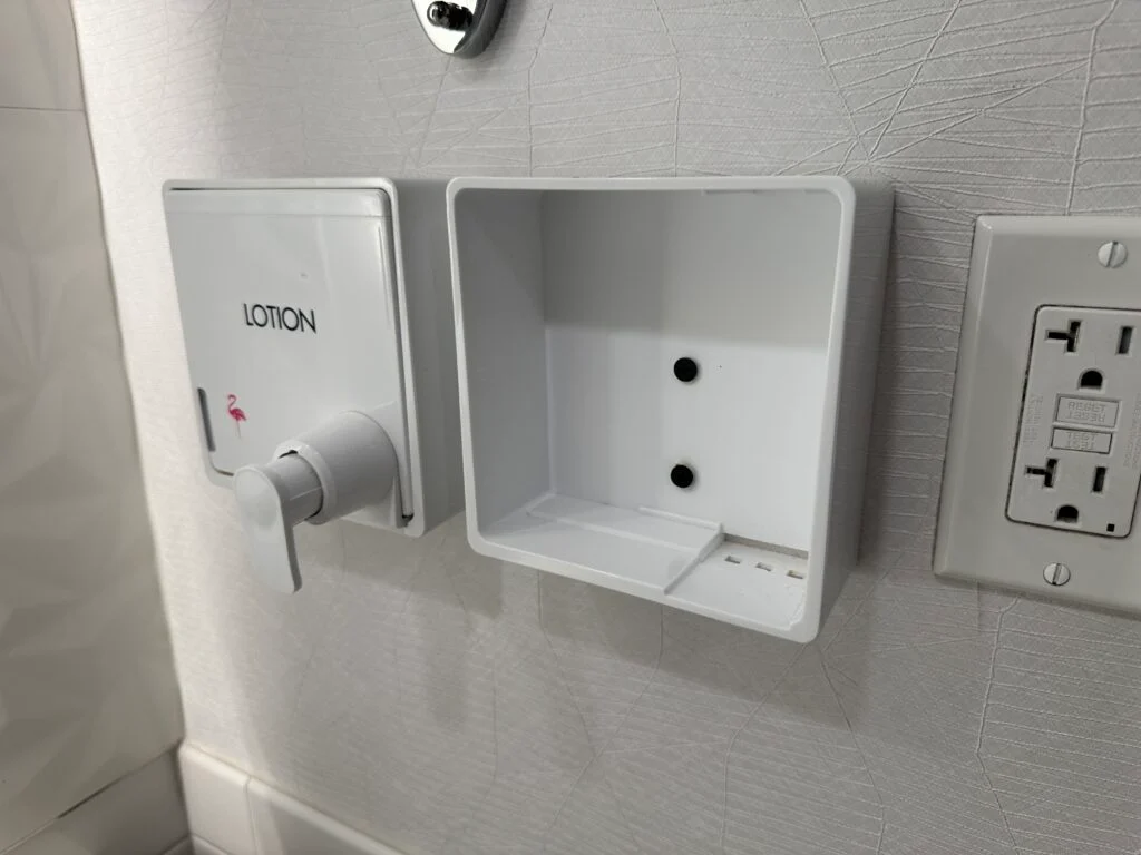 A hand soap dispenser shell, that sits empty. 