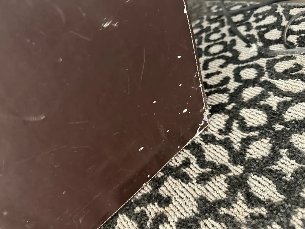 A garbage can in the bedroom. 