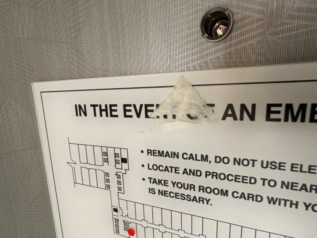 Sticker residue on the hotel door. 