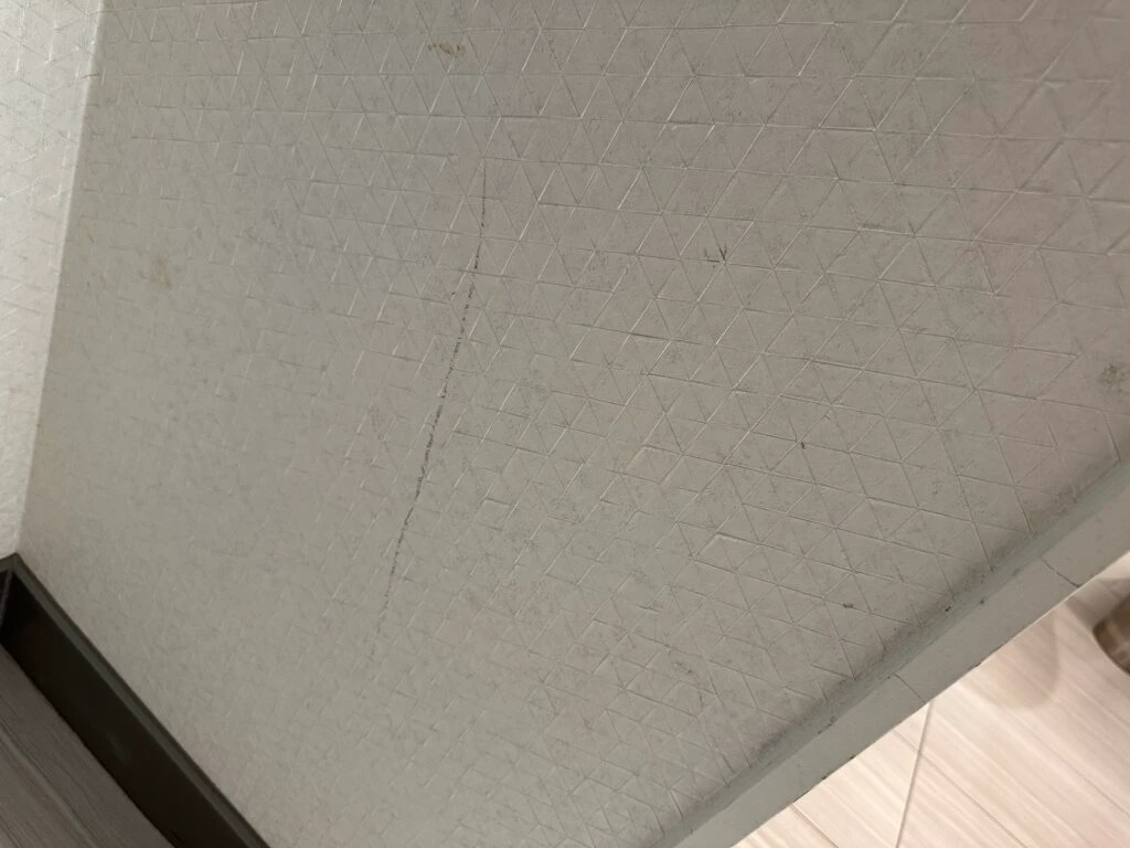 A long black scuff on the wall. 