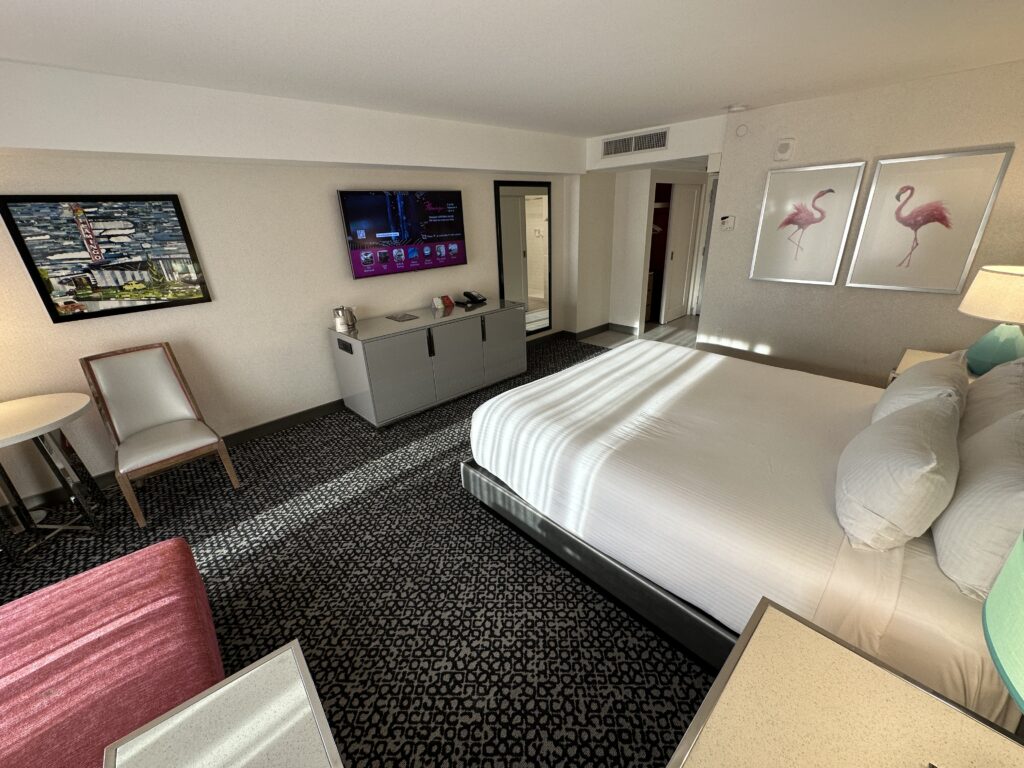 Another angle of the room that shows the bed pointed at the TV, which is mounted.