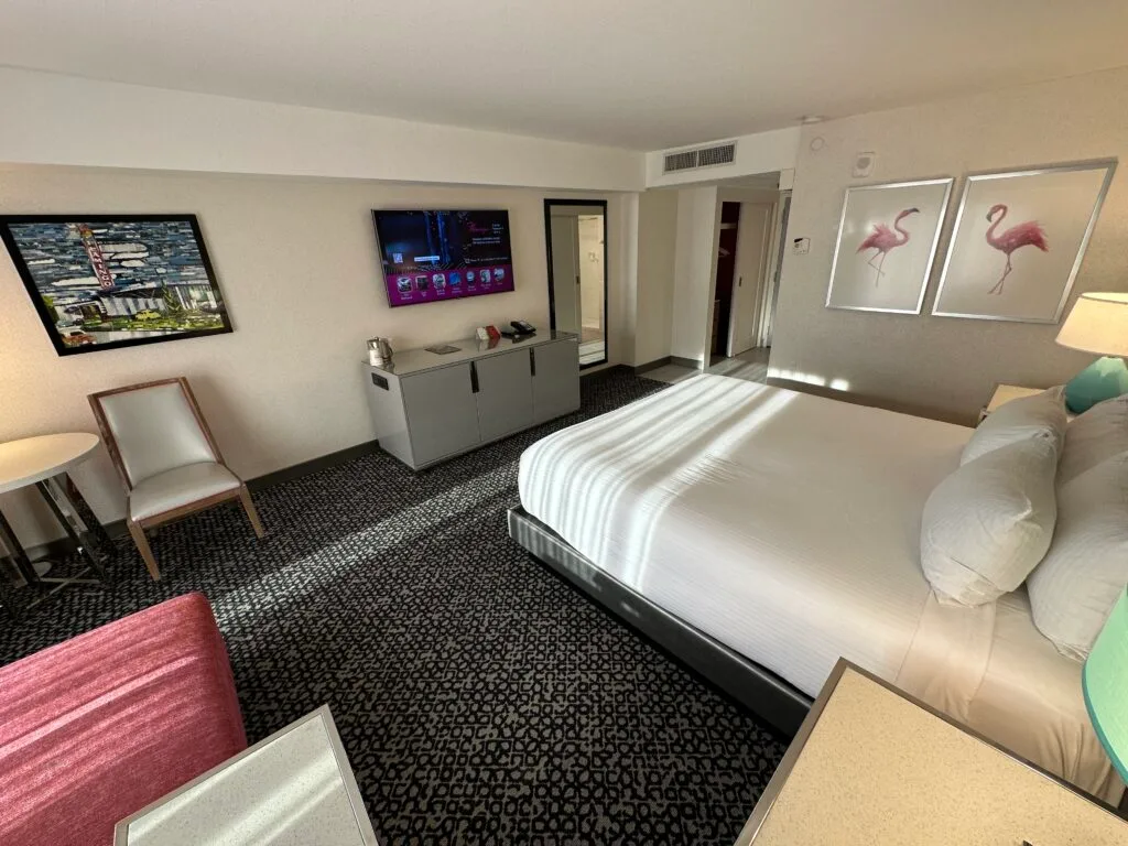 Another angle of the room that shows the bed pointed at the TV, which is mounted. 