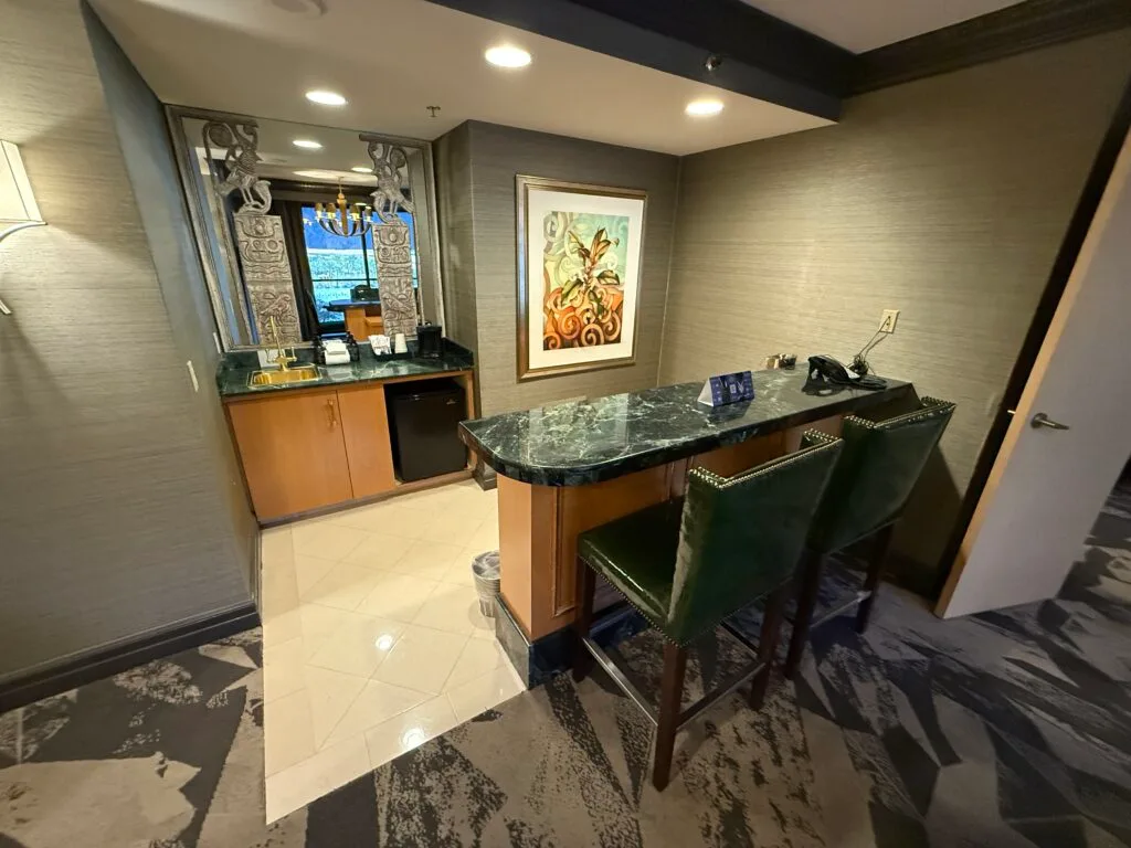 A closer view of the 2 seat bartop area. The countertops are also a hideous emerald green. 