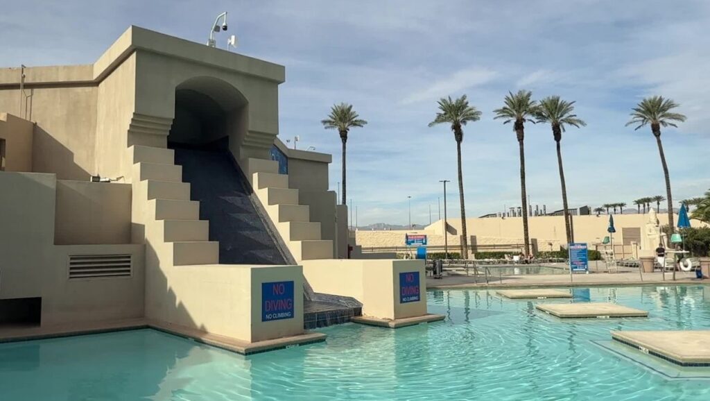 A waterfall feature spilling into one of luxor's pools.