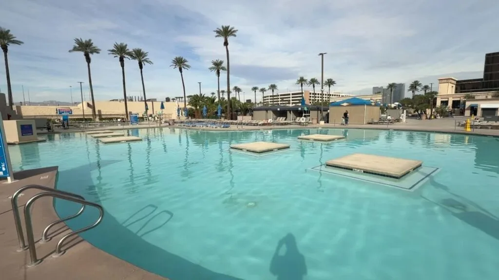 A large pool with several square "lillypads" scattered about in it.