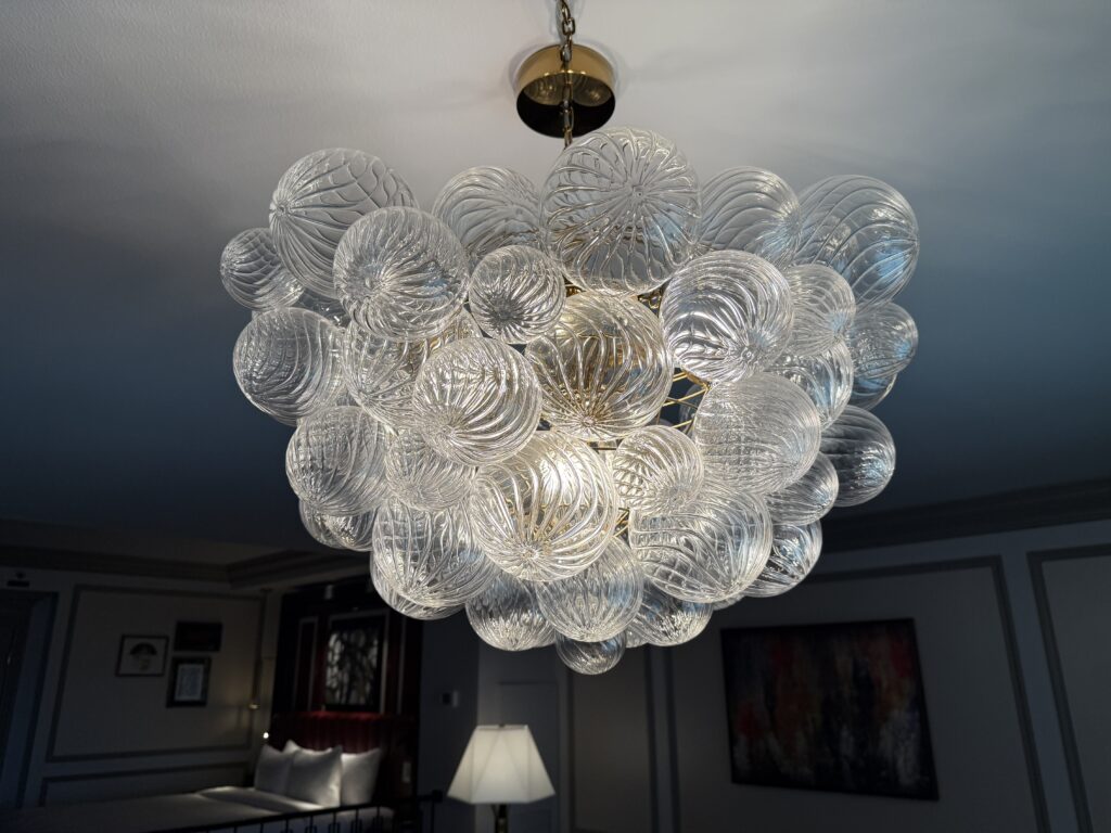 A glass light fixture hanging from the ceiling.
