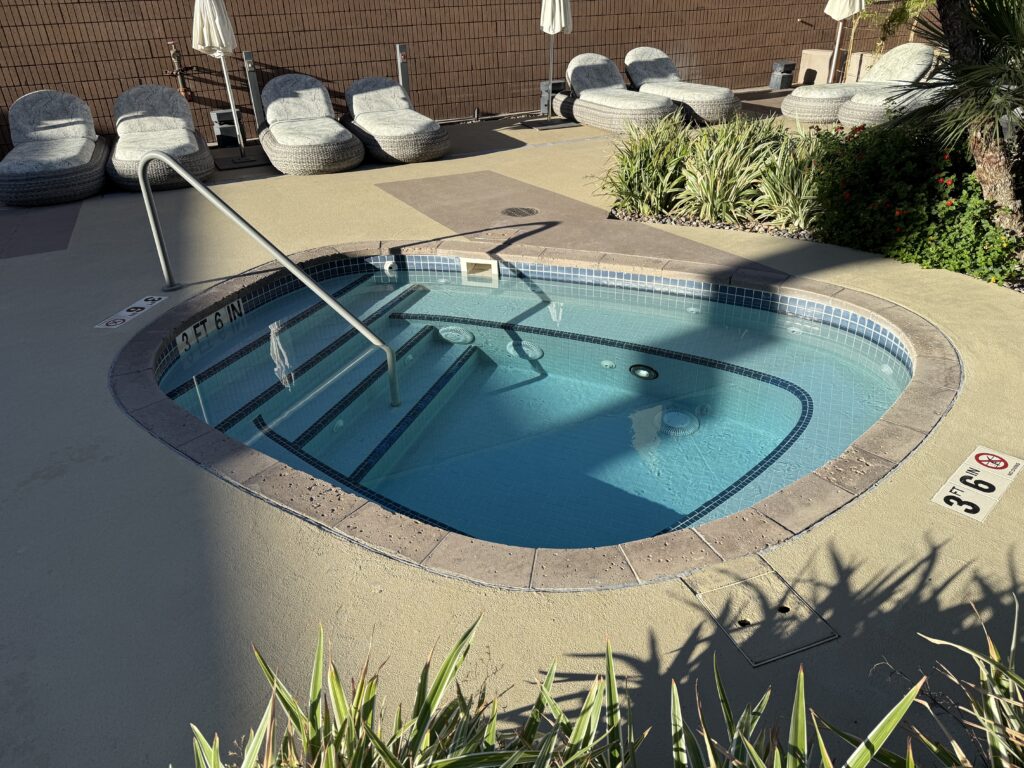 A small hot tub sitting empty.