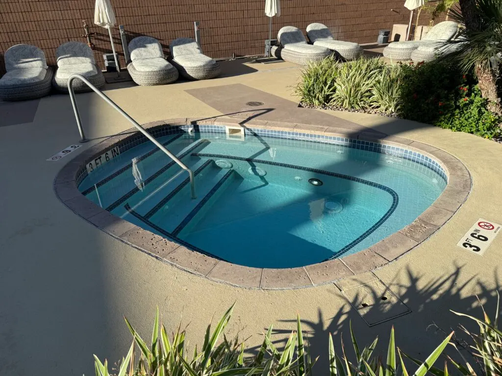 A small hot tub sitting empty. 