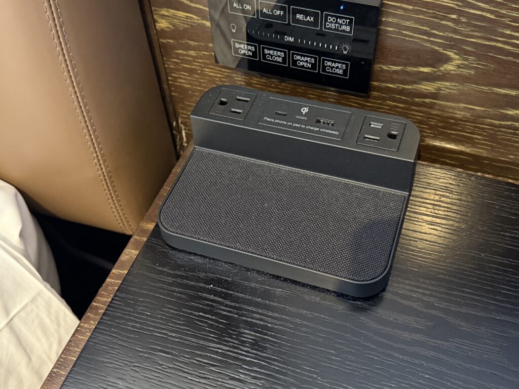 A bedside charge pad with built in outlets and USB ports.
