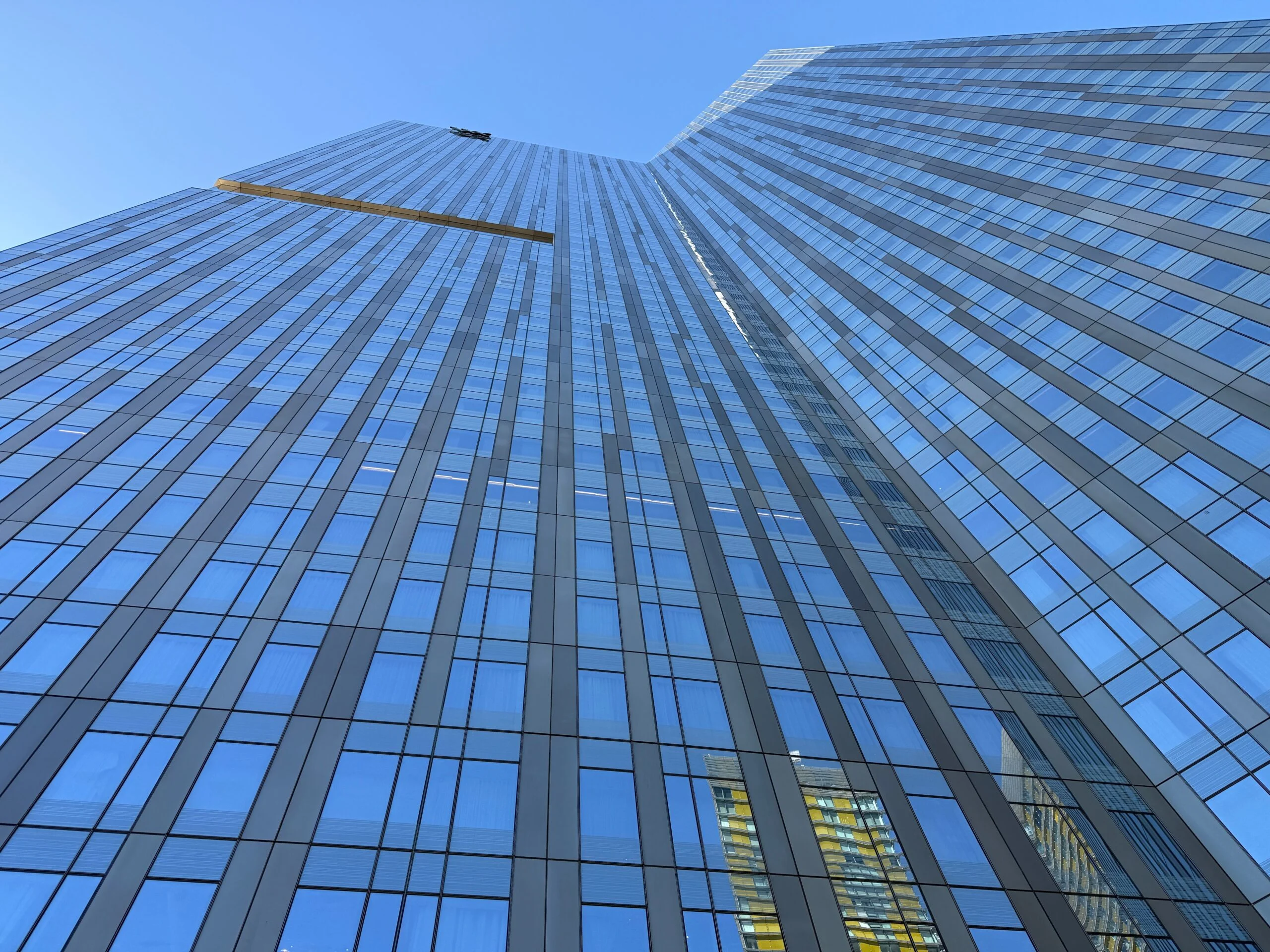 Looking straight up at Waldorf Astoria's hotel tower from the base.