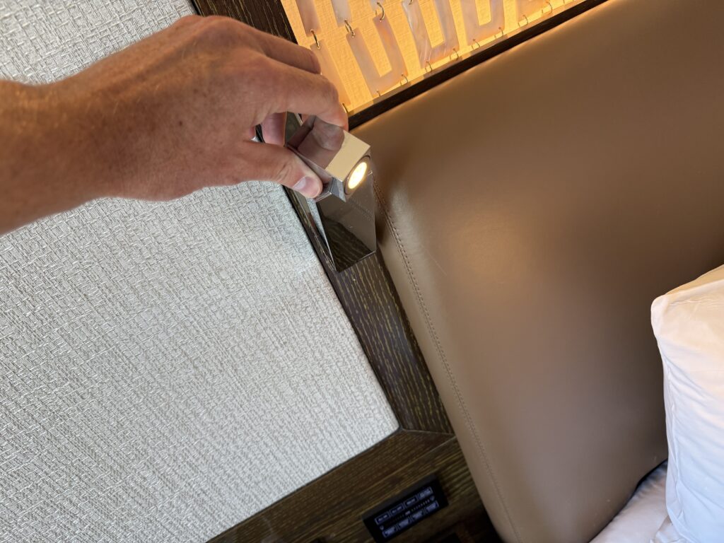 A besdie reading light built into the headboard.
