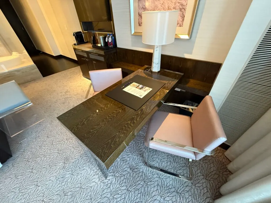 A rectangular work desk with a chair. 