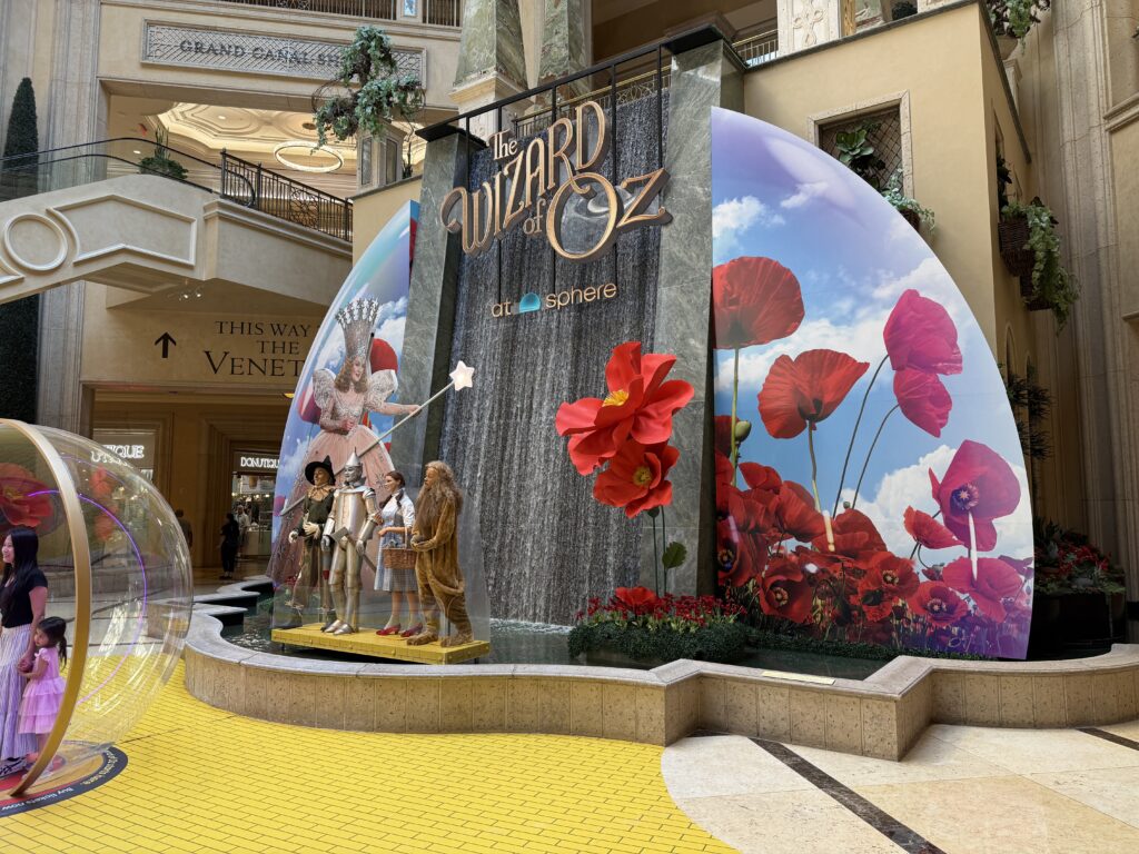 A photo op featuring the characters in Wizard of Oz, with a waterfall in the background.