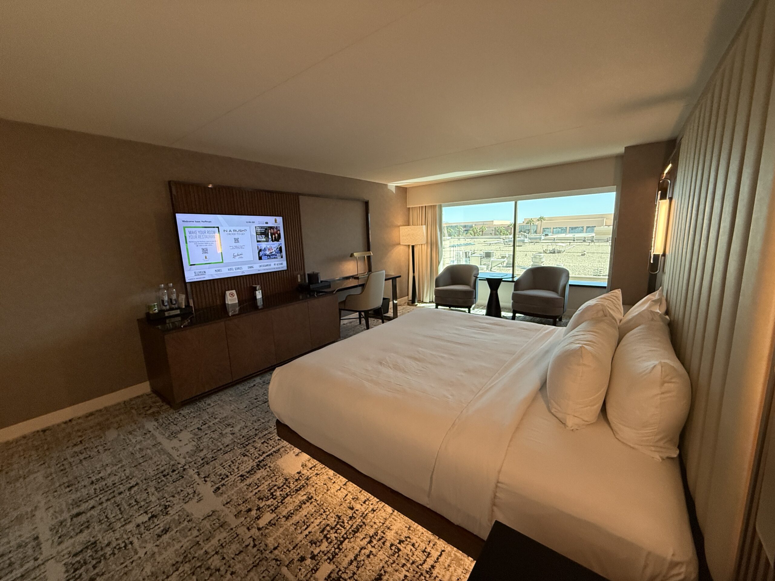 An angle of the room that shows the king bed pointed at the TV.