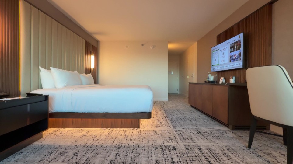 A side profile of the bed, with illumination underneath, pointed at the TV.