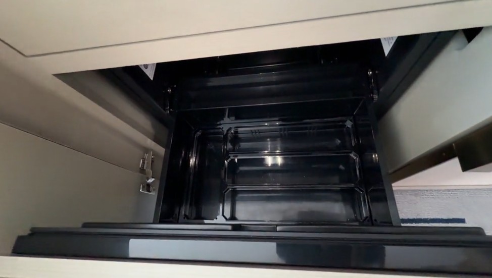 A drawer, pulled out to show the chilling drawer.