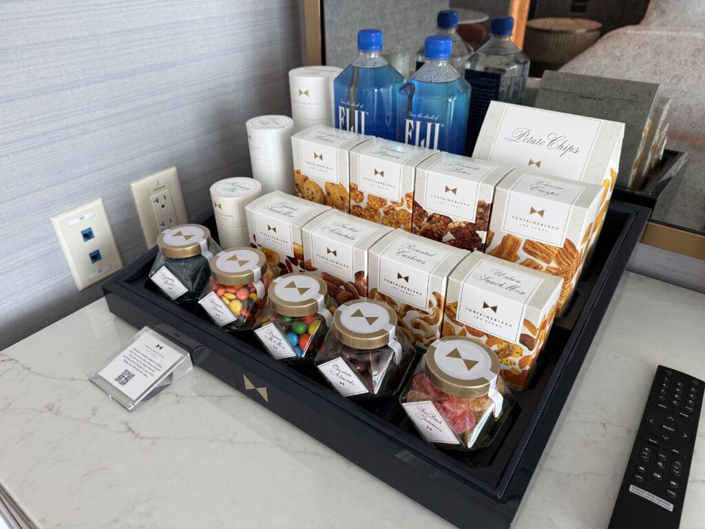 The dry minibar stocked with snacks. 