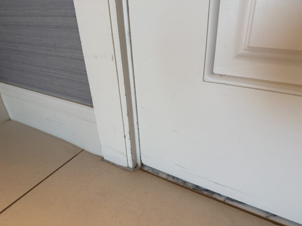 Dark scuffs on a door frame. 