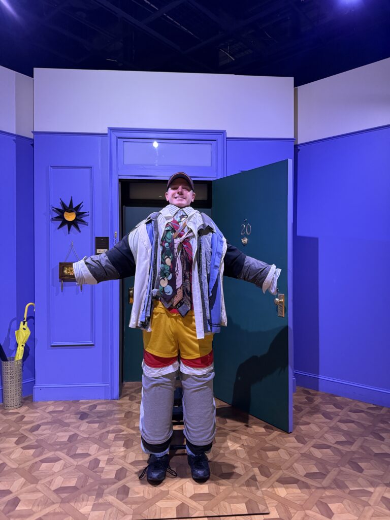 Me, posing behind a faux person wearing many many layers of clothing. 