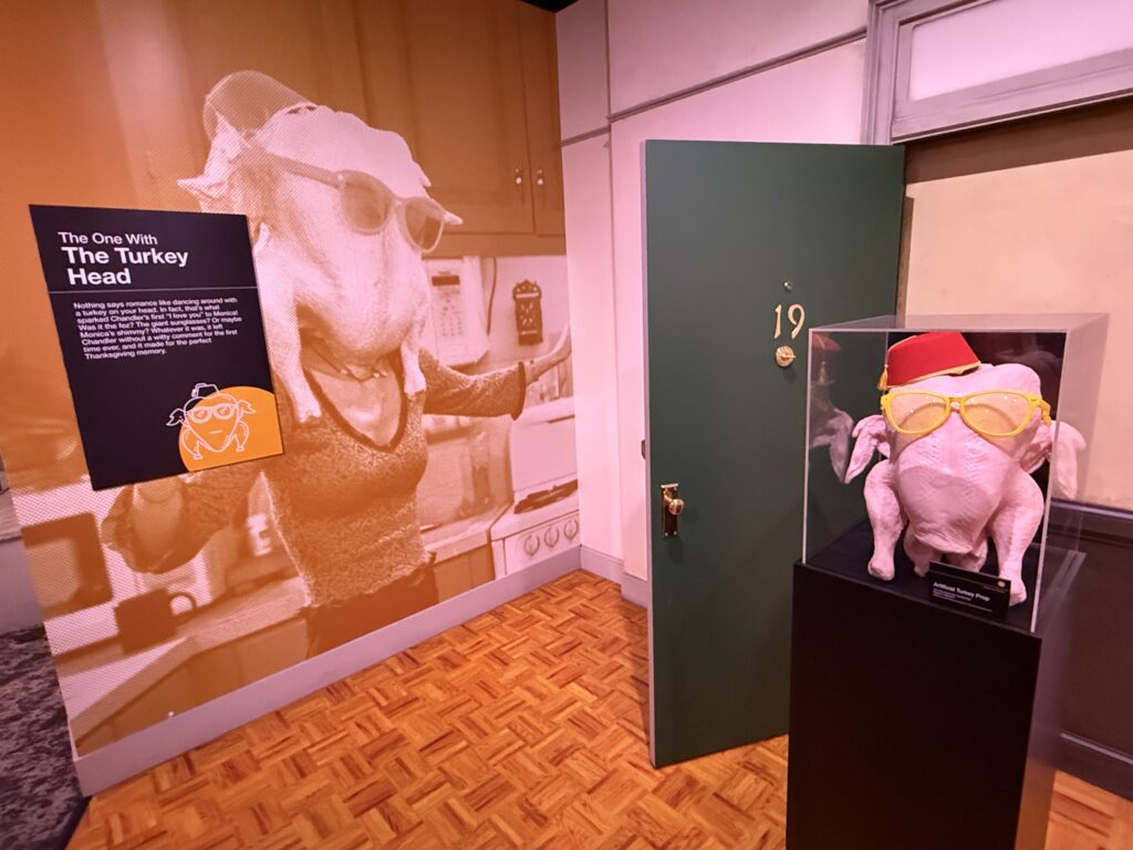 A raw turkey wearing a hat and sunglasses. 
