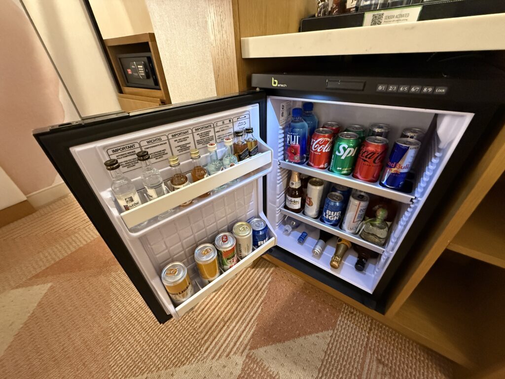 A fully stocked mini fridge minibar. 